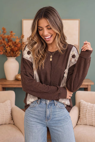 Full front view of the brown patchwork knit top with wide leg denim