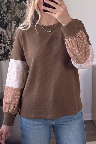 Mocha waffle knit tunic top with blush and cream floral colorblock patchwork long sleeves styled with light wash jeans and gold necklace