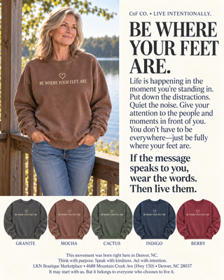 A promotional graphic for CnF Co. featuring a woman wearing a brown sweatshirt with the printed phrase 'BE WHERE YOUR FEET ARE' and a small heart.