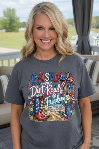 Woman wearing a t-shirt with patriotic design featuring text and graphics.